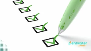 A green pen checking off a checklist on a white paper, representing the important questions to ask when deciding how to hire the best digital marketing agencies for your business.