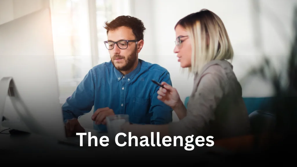 Two professionals discussing business challenges at a desk, exploring strategies on how to cut labor costs 80% with outsourcing. The conversation focuses on overcoming common workplace obstacles through effective outsourcing solutions to improve efficiency and reduce expenses.
