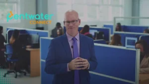 A professional smiling in an office space "What Is the Best SEO Outsourcing Solution? Discover how to evaluate SEO agencies for the best results for your business in 2025.