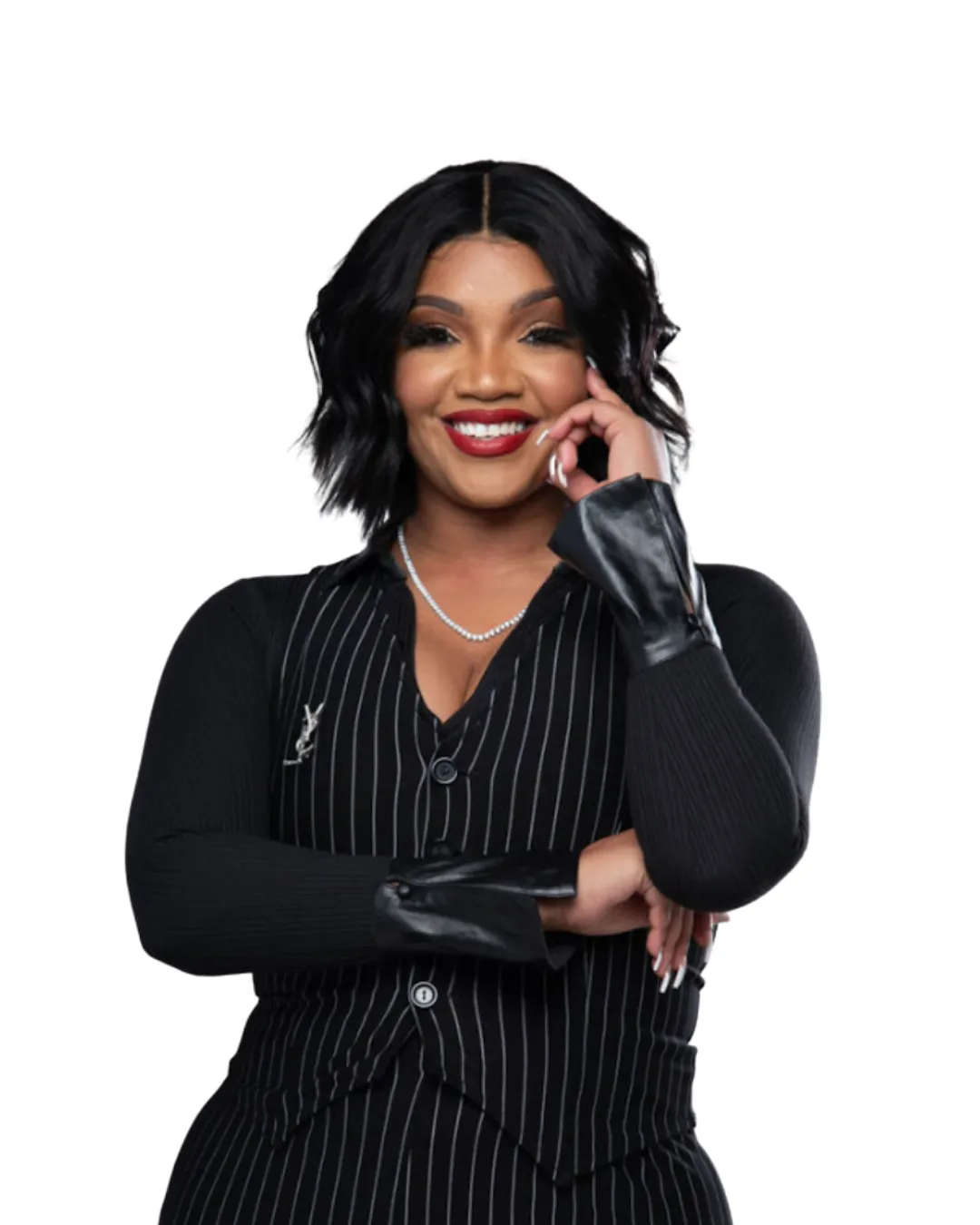 Portrait of mature man with white beard smiling outdoors on urban street with parked cars and buildings in the background.